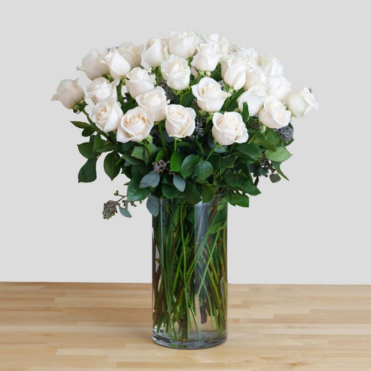 Elegant White Roses in a Glass Vase